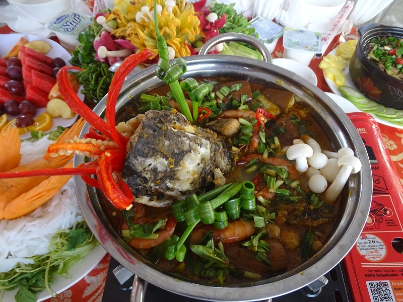 Enjoy fresh fish cooked in a rich fermented fish hotpot when visiting U Minh Ha National Park