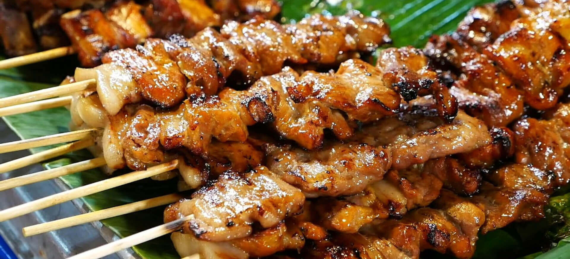 The meat is marinated in a fragrant mix then expertly charred over open flames (Source: Dong Travel)