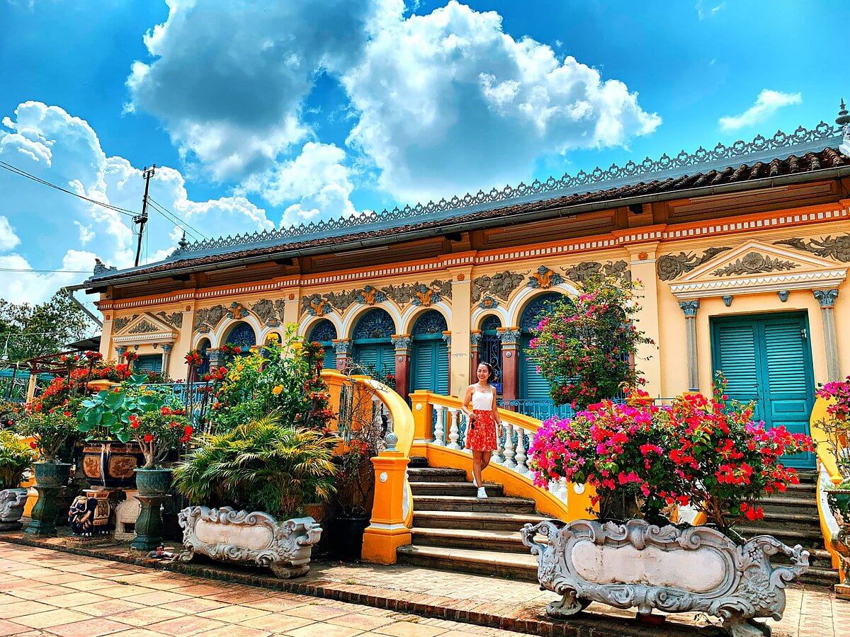 Its facade features arched windows and ornate ironwork (Source: Official Can Tho Tour Guide)