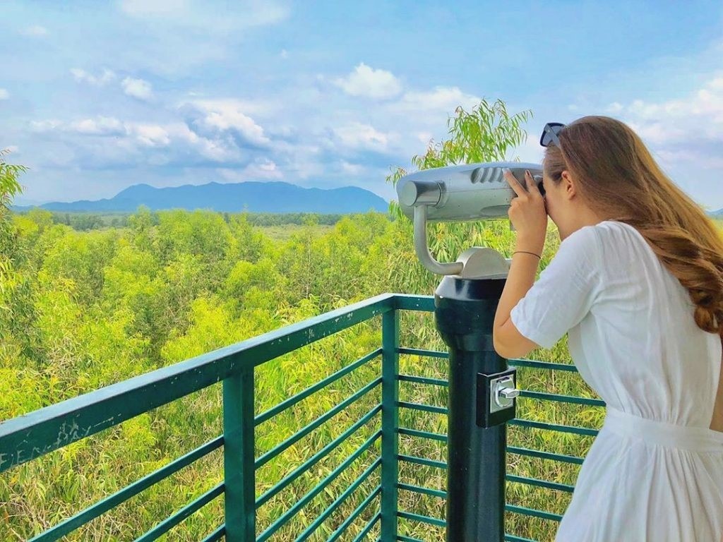 Enjoying a panoramic view from the observation tower (Source: Mekong Smile)